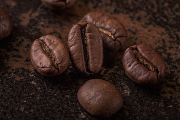 Coffee beans  on stone background. Top view with copy space for your text. Roasted coffee beans background. Beans texture, macro