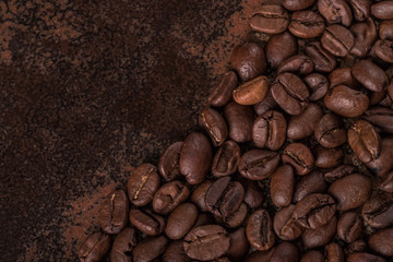 Coffee beans  on stone background. Top view with copy space for your text. Roasted coffee beans background. Beans texture, macro