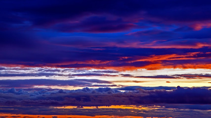 Unrealistic colorful sunset in the lush clouds in Iceland