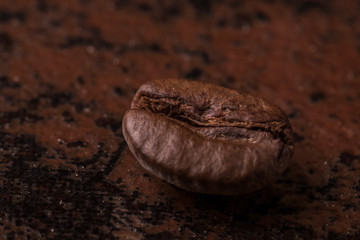 Coffee beans  on stone background. Top view with copy space for your text. Roasted coffee beans background. Beans texture, macro