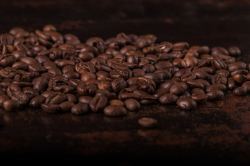 Coffee beans  on stone background. Top view with copy space for your text. Roasted coffee beans background. Beans texture, macro