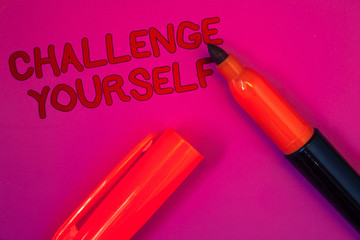 Conceptual hand writing showing Challenge Yourself. Business photo text Overcome Confidence Strong Encouragement Improvement Dare Magenta color platform dark red color tidings corner red marker