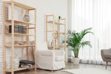 Wooden storage in stylish living room. Idea for interior design