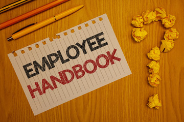 Conceptual hand writing showing Employee Handbook. Business photo text Document Manual Regulations Rules Guidebook Policy Code Words written Note Desk Pen Pencil Question mark Crumbled paper