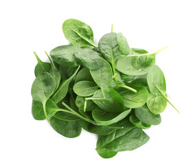Pile of fresh green healthy baby spinach leaves on white background, top view