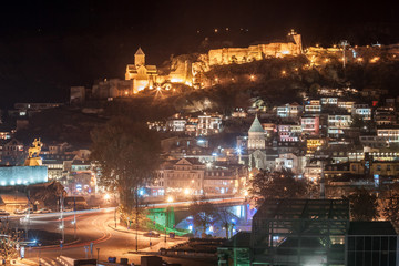 Night view of old Tbilisi. Narikala Fortress and other landmarks of the city.