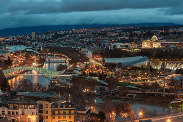 Evening view of Tbilisi with Sameba (Trinity) Church and other landmarks. Travel.