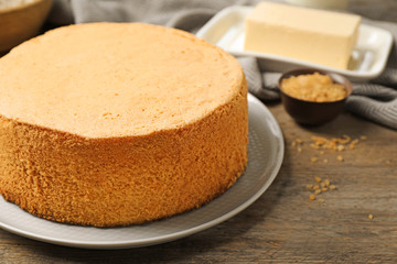 Delicious fresh homemade cake on wooden table