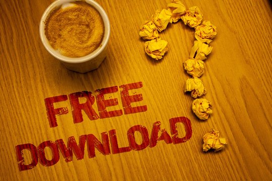 Text sign showing Free Download. Conceptual photo Files Downloading Without Any Charges Online Technology Words written Desk Coffee White mug crumbled paper notes question mark