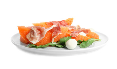 Fresh melon with prosciutto, mozzarella and arugula on white background