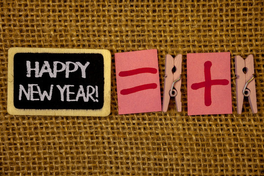 Writing note showing Happy New Year Motivational Call. Business photo showcasing Greeting Celebrating Holiday Fresh Start Ideas on blackboard chalk letters equal plus signs cloth pins wicker