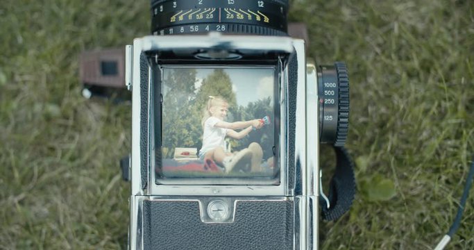 girl's portrait with old camera
