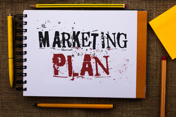 Writing note showing Marketing Plan. Business photo showcasing Business Advertising Strategies Market Successful Ideas Text white notepad yellow pen pencil around sketch stress school work