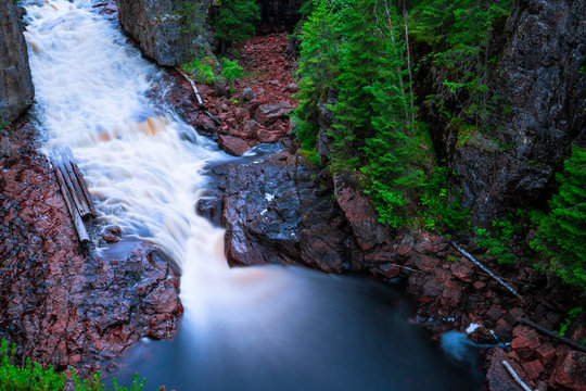 Waterfall (Helvetesfallet) in forest, Sweden