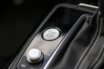 Engine start stop button