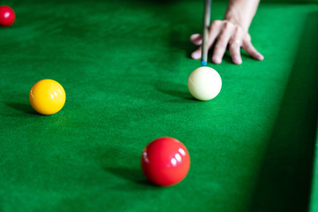 Game snooker billiards or opening frame player ready for the ball shot, athlete man kick cue on the green table in bar.