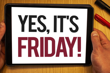 Fototapeta premium Handwriting text Yes, It'S Friday Motivational Call. Concept meaning having weekend Taking rest break Hand hold showing colorful letters black marker red pen timber carrel