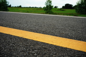 Road traffic paint Yellow on the asphalt surface