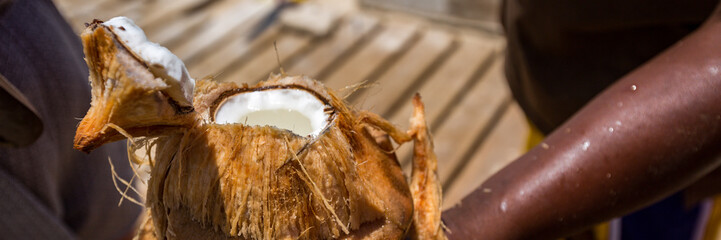 Man with coconut, panorama