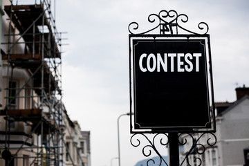 Writing note showing Contest. Business photo showcasing Game Tournament Competition Event Trial Conquest Battle Struggle Vintage black board sky old city ideas scaffolding landscapes antique