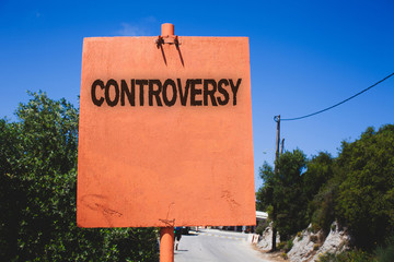 Conceptual hand writing showing Controversy. Business photo text Disagreement or Argument about something important to people Wooden board post ideas blue sky trees antique vintage landscape