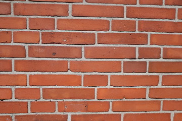 Background with an old wall of red bricks, texture and copy space
