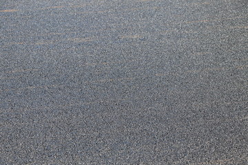 Background with fine tar surface of a new asphalt road. Closeup, Copy space