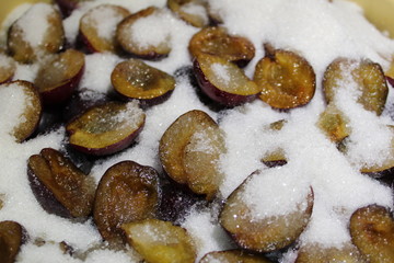halves of plums pitted with sugar