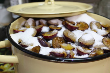 fresh plum with sugar in a jam pot 