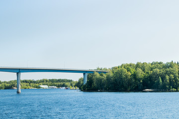 Fototapeta na wymiar Luukkaansalmi bridge in Lappeenranta, Finland. View from the lake Saimaa.