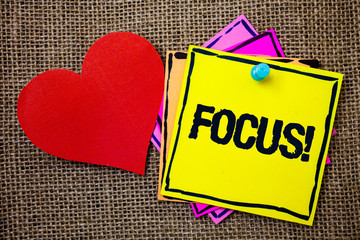 Writing note showing Focus Motivational Call. Business photo showcasing Point of concentration Center activity Attraction Ideas messages paper papers red heart love message jute background