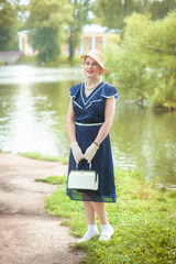 Beautiful woman retro style in blue dress