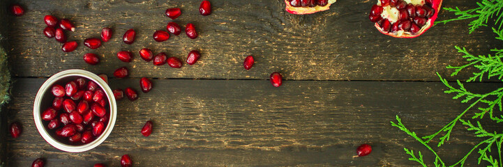 pomegranate fruit red and branches green  (vitamin dessert) good New Year spirit holiday. top food background. copy space