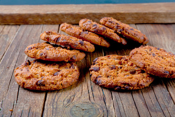 Oatmeal cookies on a wooden table.
