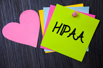 Writing note showing Hipaa. Business photo showcasing Health Insurance Portability and Accountability Act Healthcare Law Papers heart wood wooden background love lovely message ideas thoughts