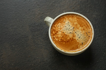 coffee freshly brewed in a white cup serving of beverage (coffee grain). food. top. copy space