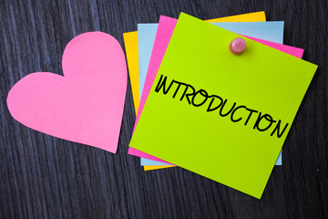 Writing note showing Introduction. Business photo showcasing First part of a document Formal presentation to an audience Papers heart wood wooden background love lovely message ideas thoughts