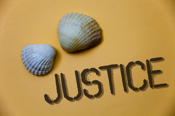 Handwriting text writing Justice. Concept meaning Quality of being just impartial or fair Administration of law rules Grunge ideas messages shells light brown background beach memories thoughts