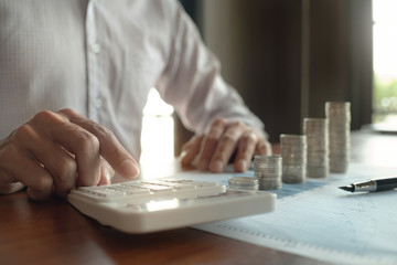 business people with coin stack and data spreadsheets, Investment concept.