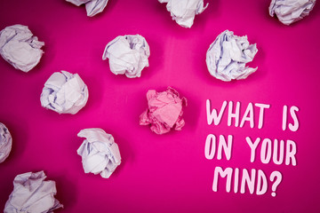Conceptual hand writing showing What Is On Your Mind Question. Business photo text Open minded thinks of intellectual innovation Ideas pink background crumpled papers trial mistakes several tries