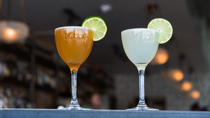 Glasses of cocktails on table