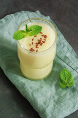 Fresh melon smoothie with flax seeds and mint leaves. Healthy diet drink. The concept of vegan and vegetarian food. Selective focus.