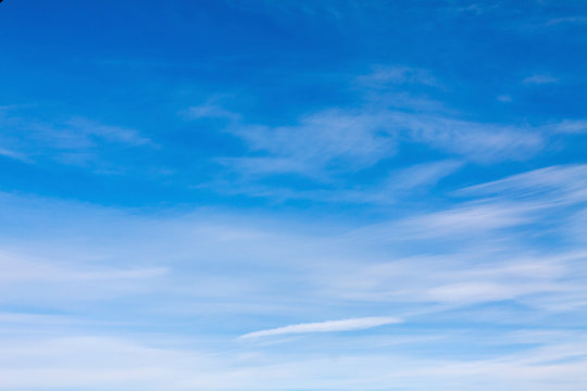 dense blue clouds in twiling sky in winter evening.