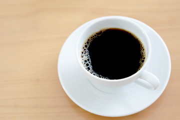 Cup of coffee on weathered table