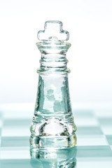 Obraz na płótnie Canvas Chess glass transparent king isolated on white