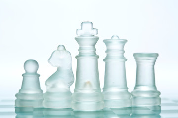 Transparent glass chess isolated on white