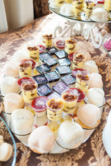 Fototapeta na wymiar Candy bar. Sweets table on wedding party