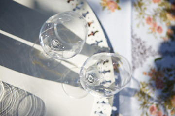 Close-up view on the empty wine glasses on white tray