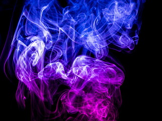 Colored smoke on black background