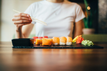 Unrecognizable young woman eating